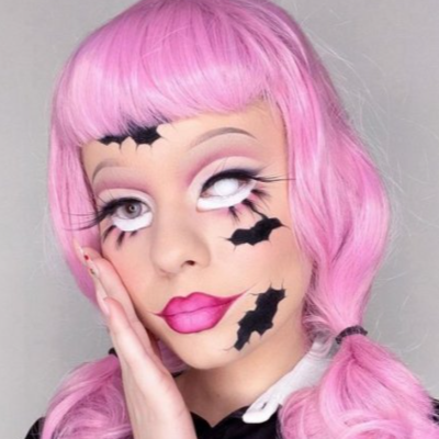Pink pinup style wig, with finger waves and a short fringe: Stevie