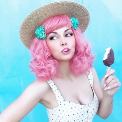 Pink pinup style wig, with finger waves and a short fringe: Stevie